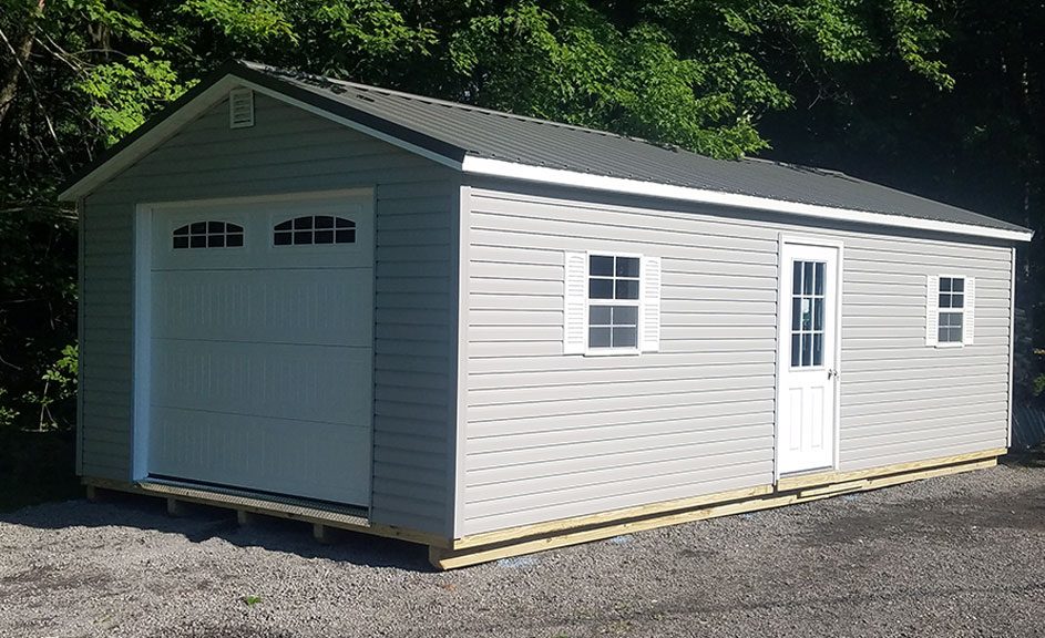 Custom garage building, Twilight Gray siding, Charcoal metal roof, 2 windows, with Sonoma garage doors with windows Meadville Pa