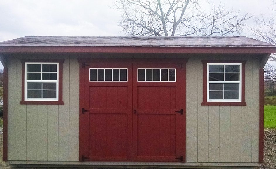 Saltbox shed with clay wood siding and jamestown red trim