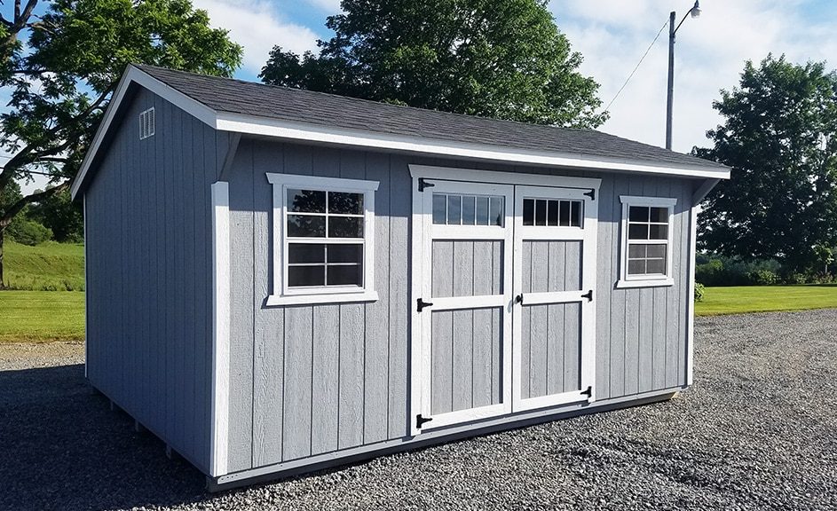 Saltbox storage shed Wood siding with capecod gray paint, white trim, and black shingles